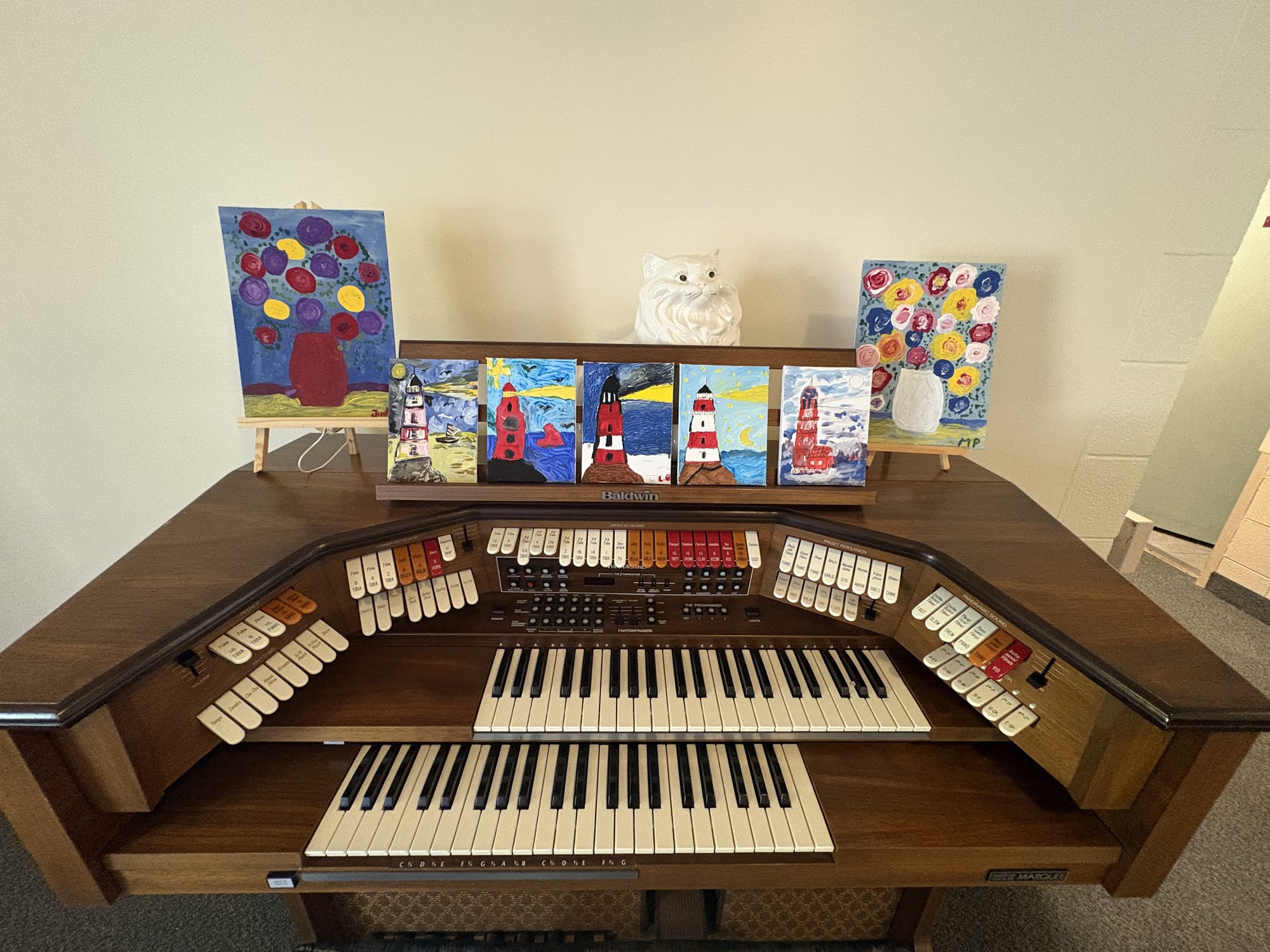 Common area with organ and resident artwork